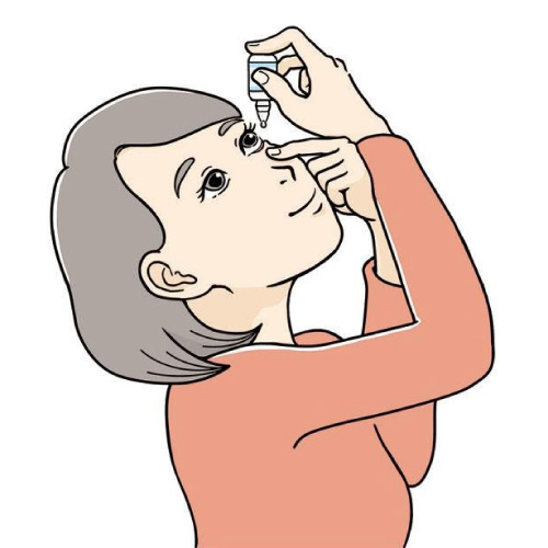 woman putting eye drops in her eyes